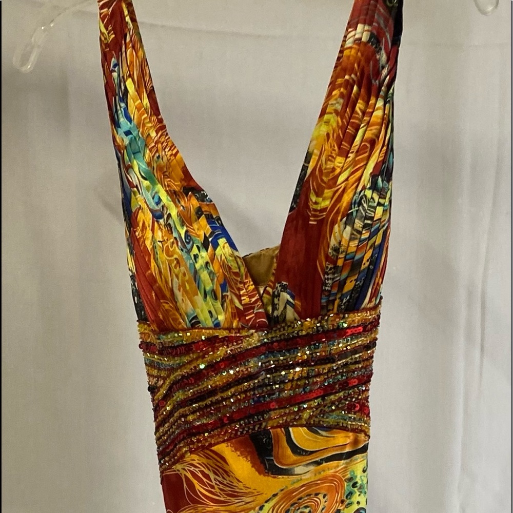 Jovani Milti Colored Long Cocktail Dresses
Excellent condition. 
Sizes- 4/6